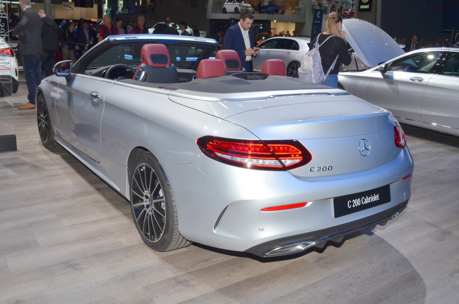 Convertible rear view with sleek taillights and red leather seats