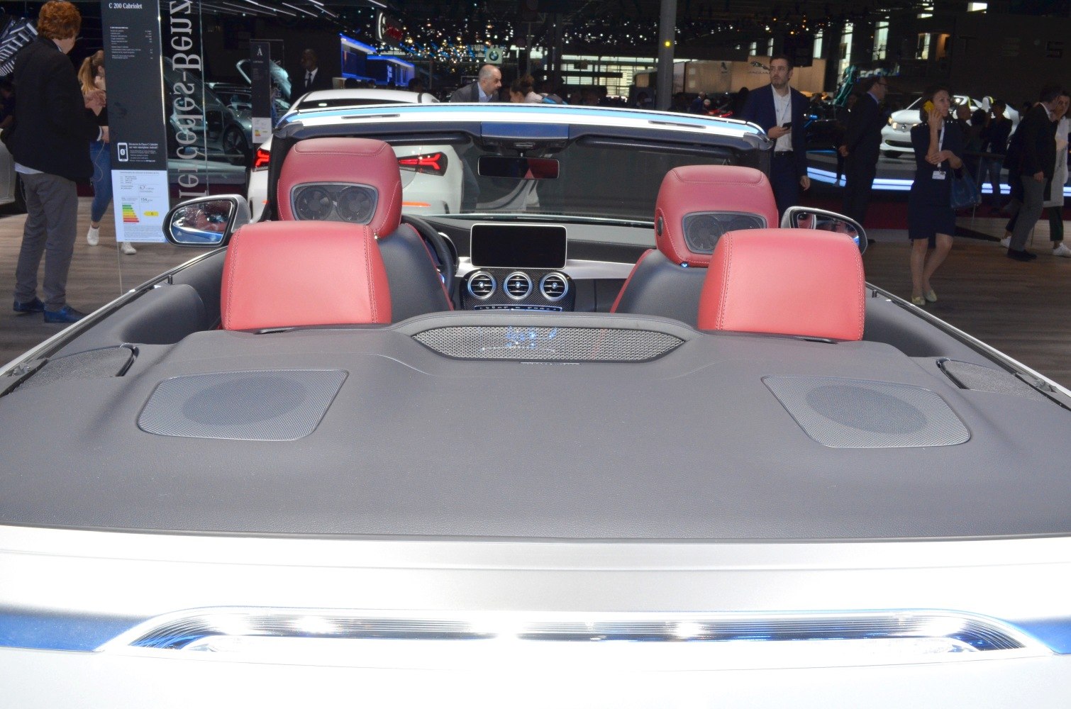 Convertible interior with red leather seats and rear speaker setup