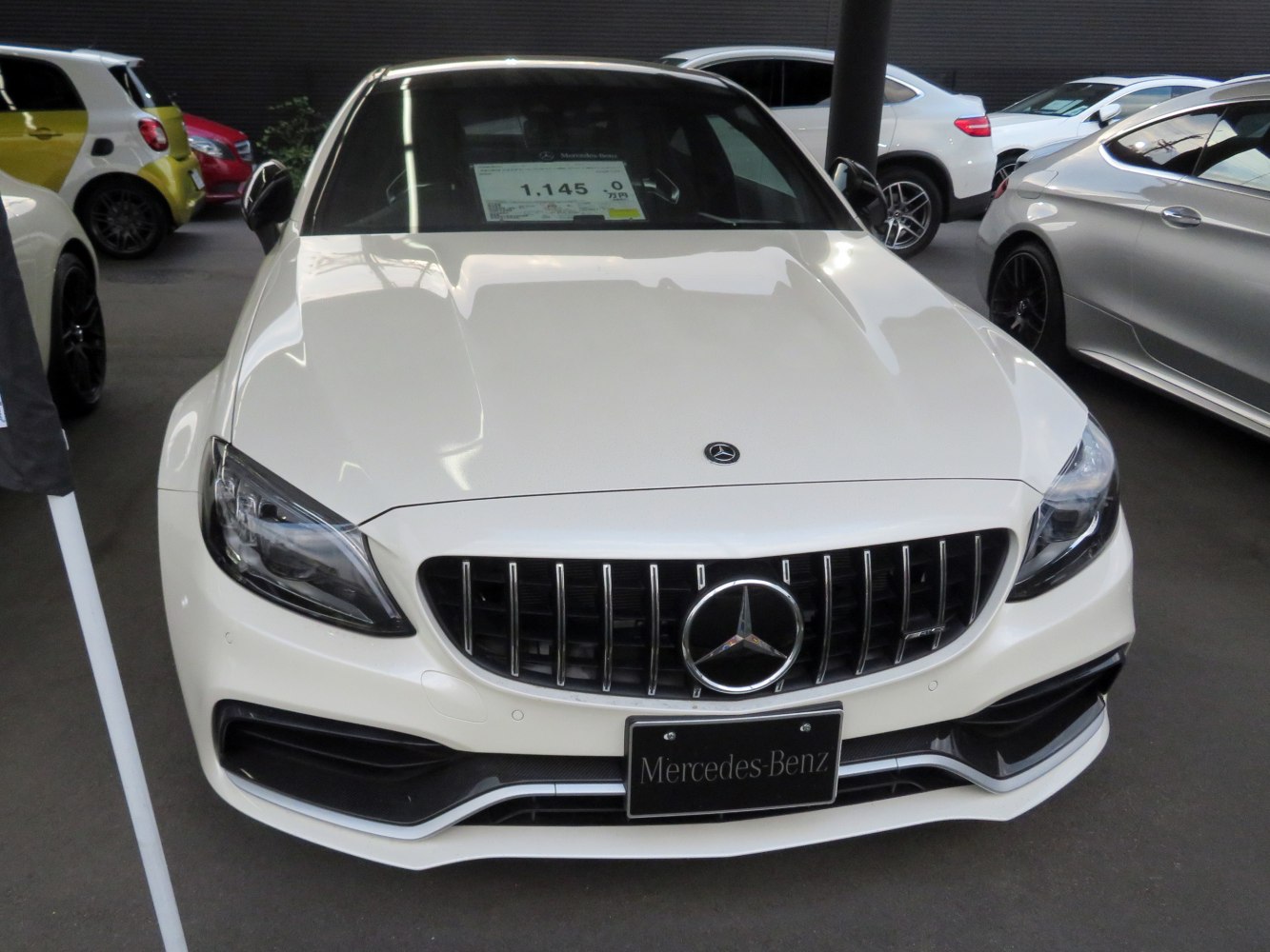 AMG-style vertical grille and sleek headlight design on front fascia