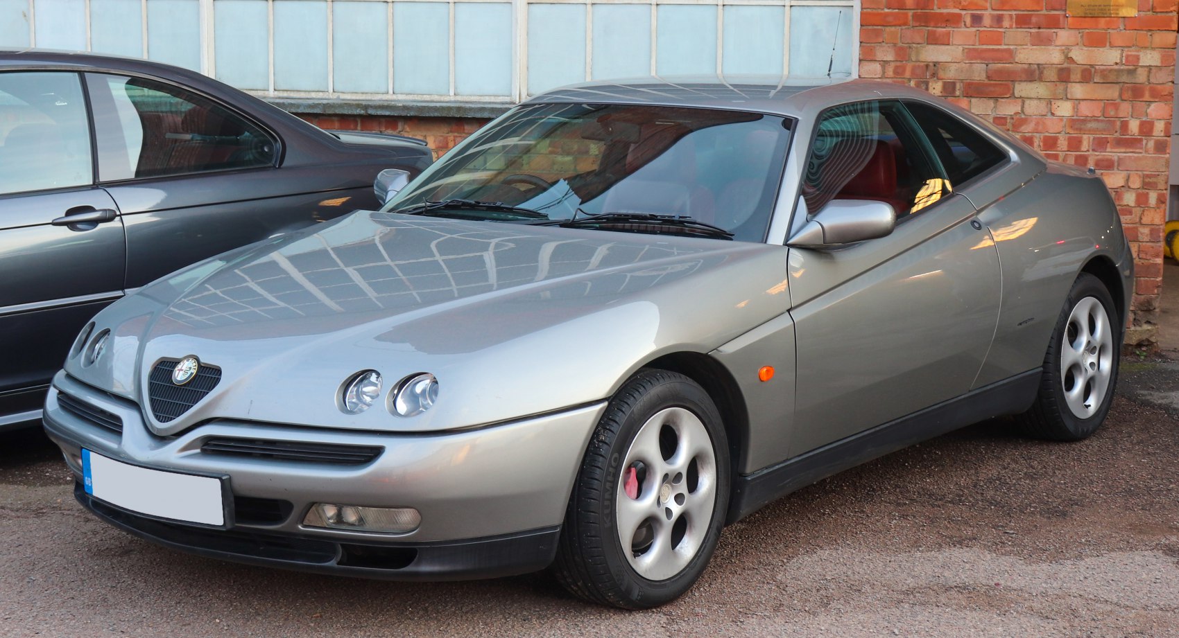 Front fascia and quad headlights of a sleek coupe