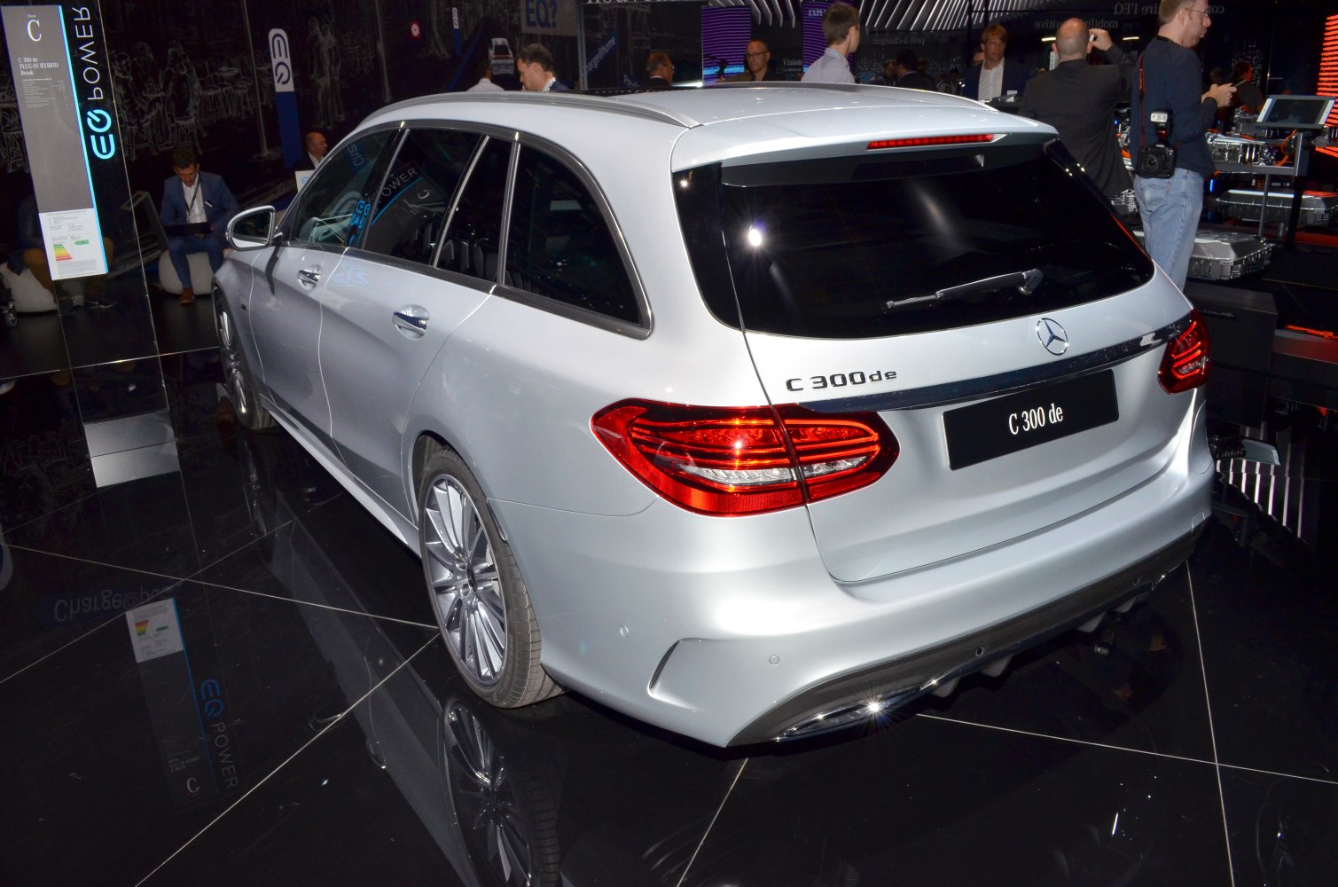 Silver estate car rear with distinctive taillights and roof spoiler