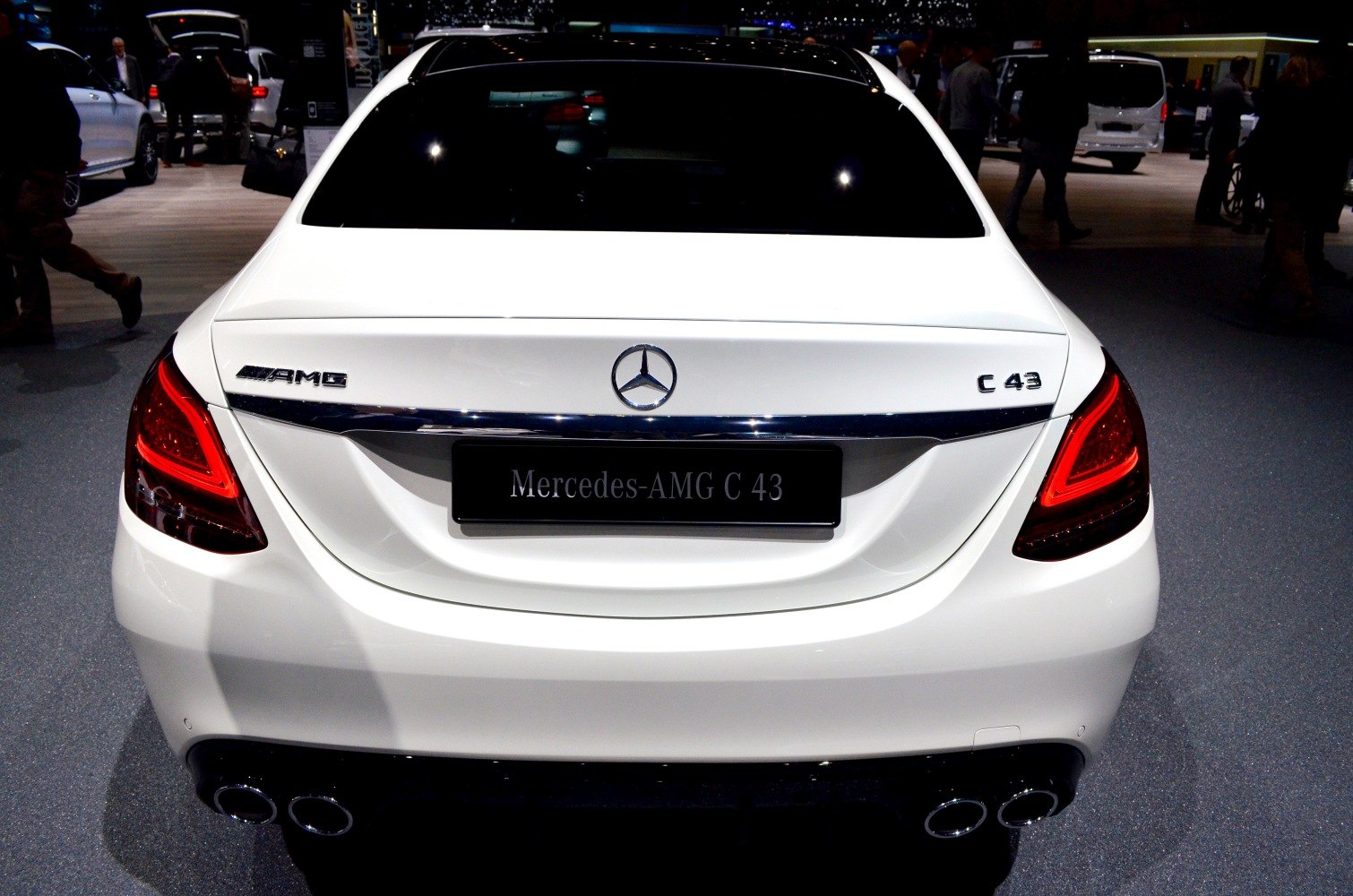 Rear of sedan with quad exhaust tips and LED tail lights