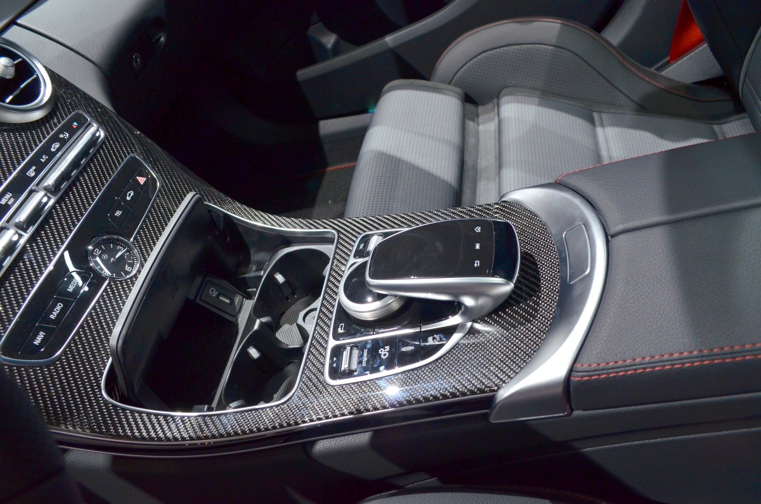 Carbon fiber center console with advanced control panel and leather seats