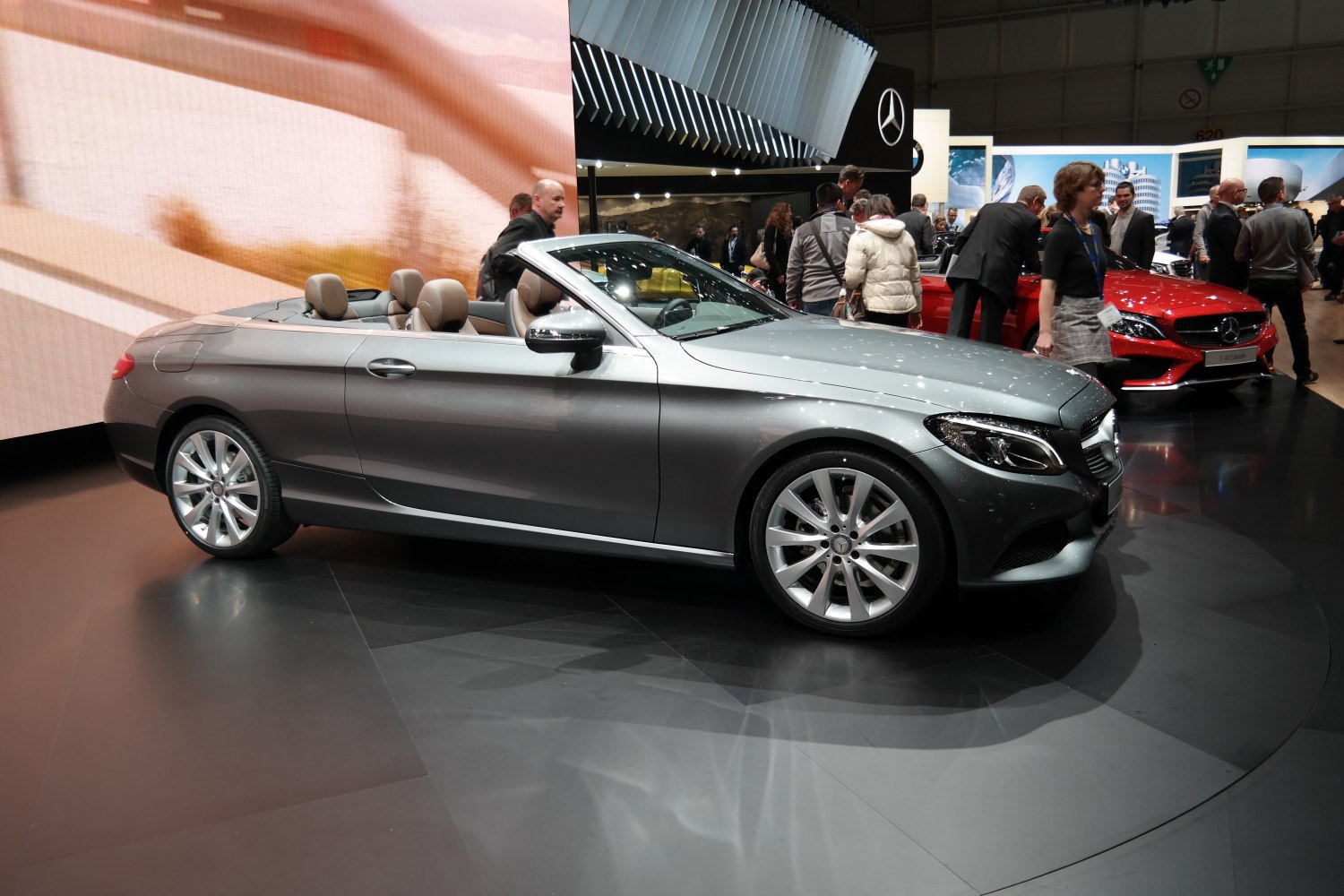 Convertible luxury coupe with sleek silver body and alloy wheels