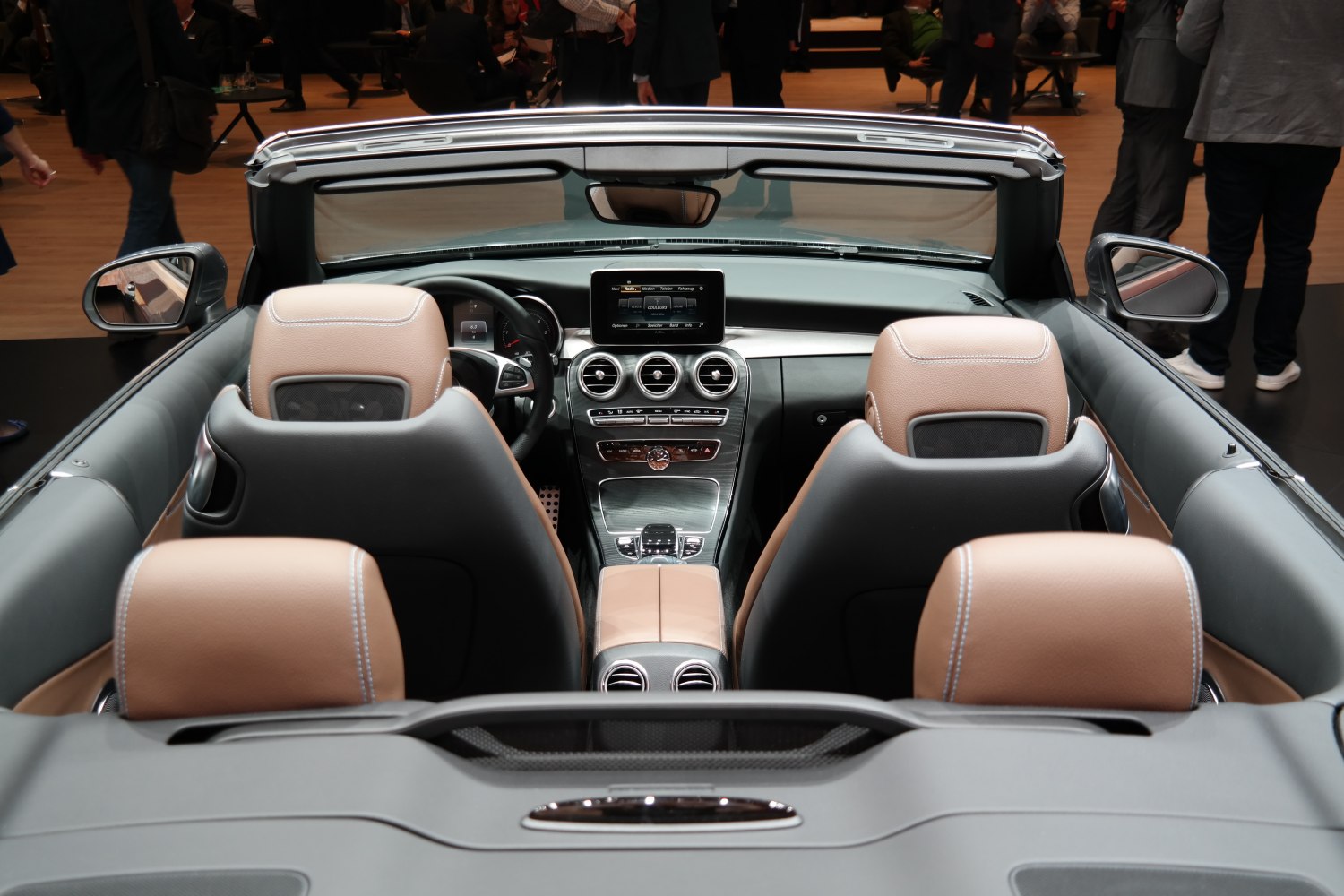 Convertible interior with beige leather seats and modern dashboard