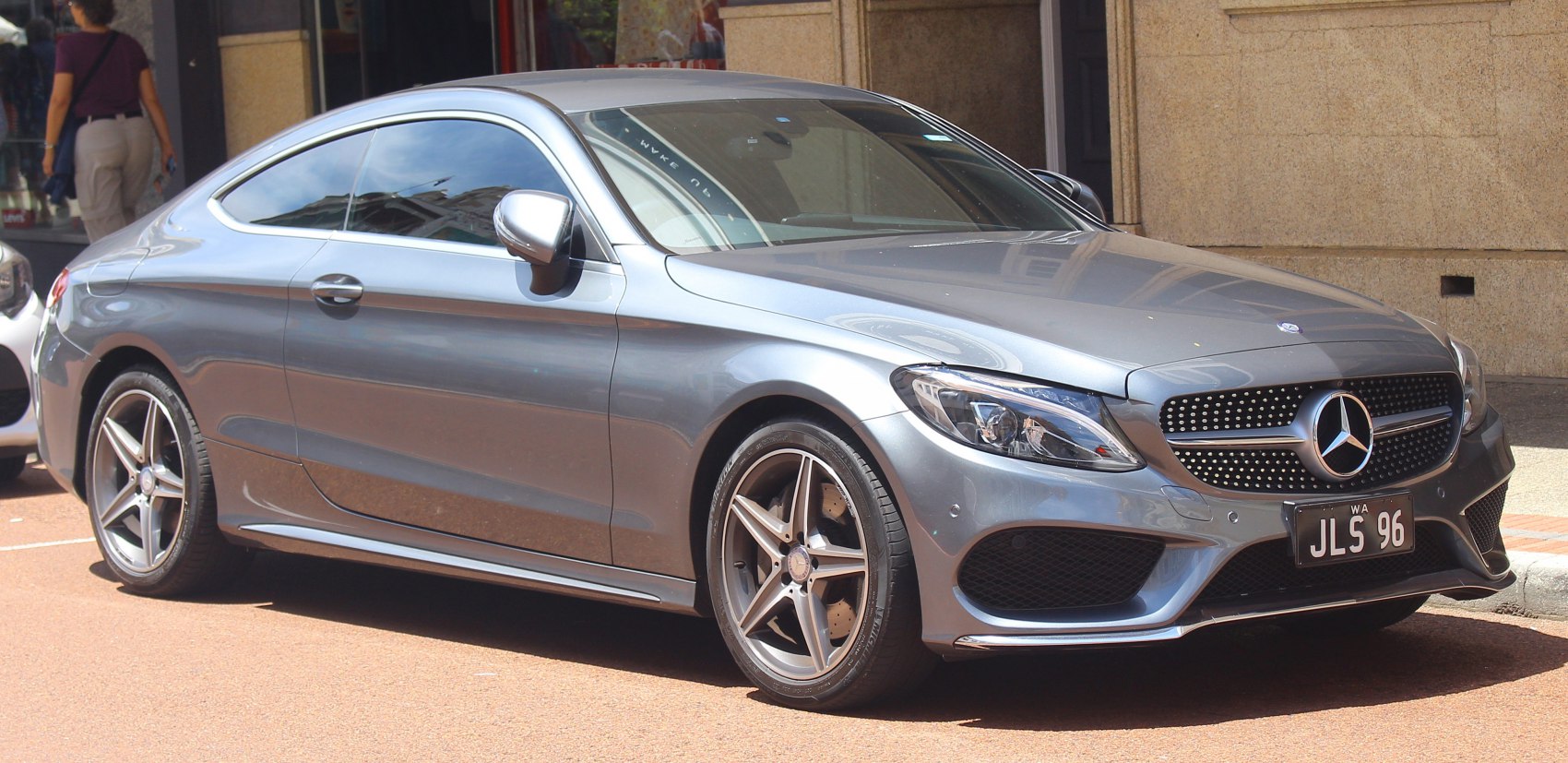 Luxury coupe with silver paint, LED headlights, and five-spoke alloy wheels