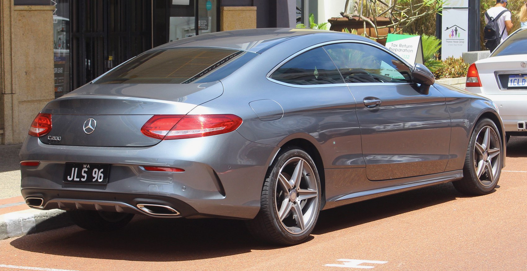 Rear view of a grey coupe with LED taillights and dual exhaust tips
