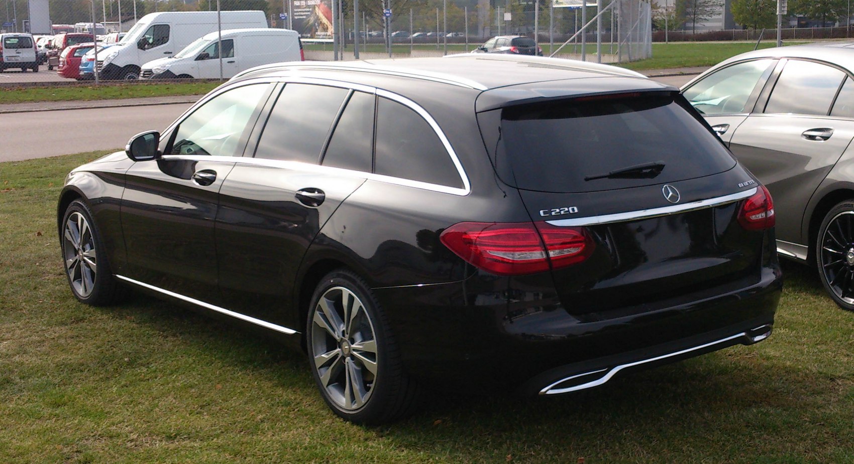 Black station wagon with chrome trim and alloy wheels