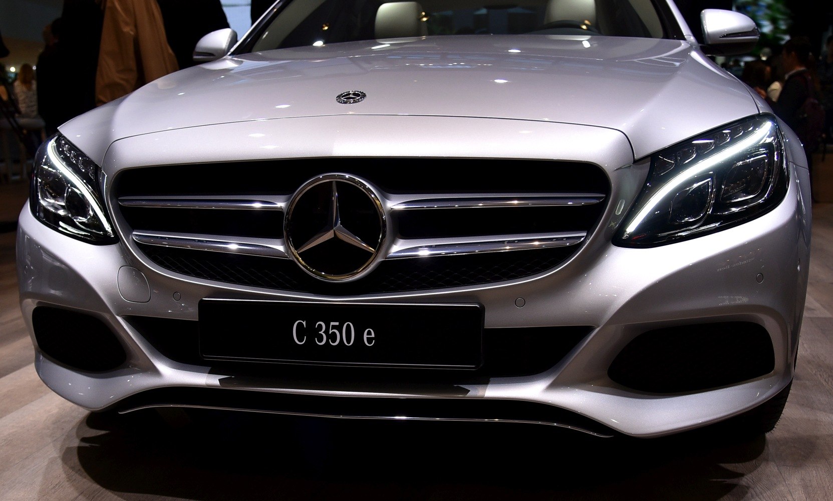 Close-up of front grille and LED headlights of a luxury sedan
