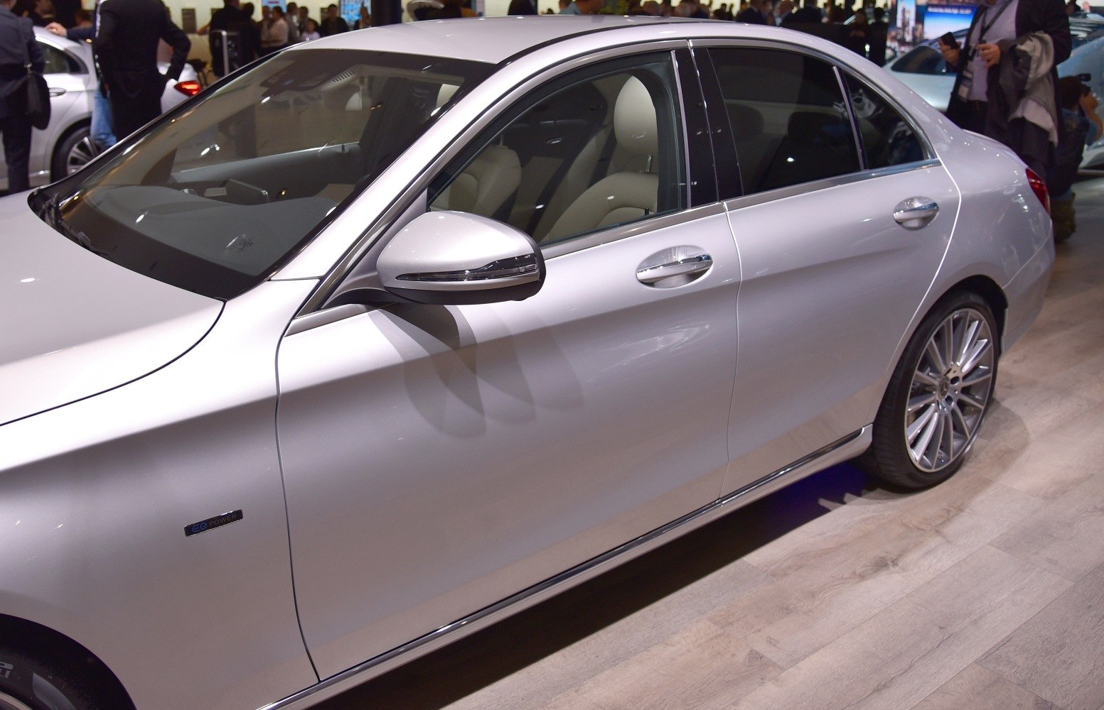 Side profile with door and alloy wheel of a silver sedan