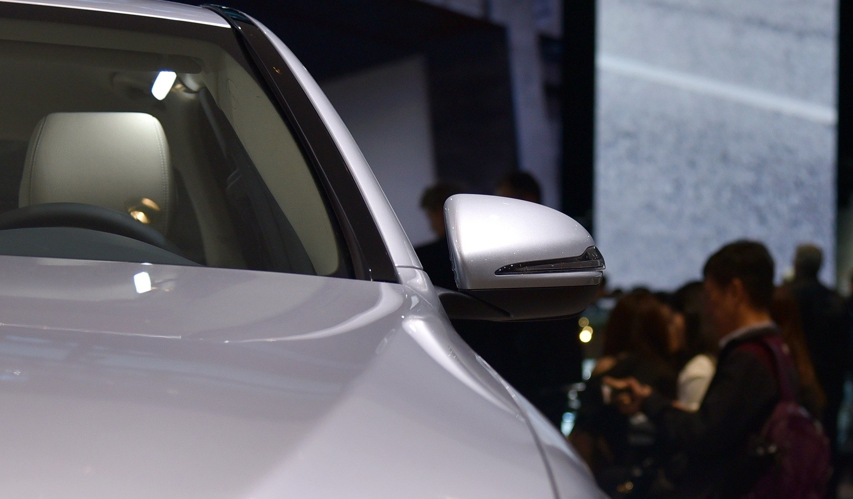 Close-up of side mirror and front hood