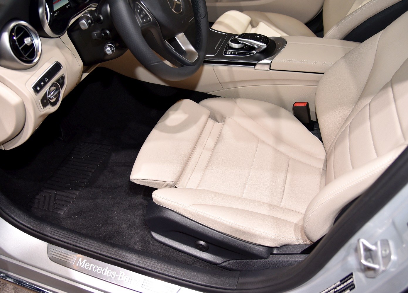 Premium beige leather front seat and dashboard with center console controls