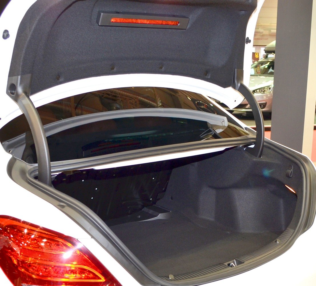 Spacious open trunk interior of a sedan with clean, smooth floor and side contours