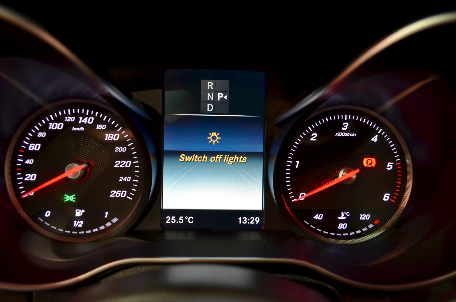 Instrument cluster with speedometer, tachometer, and digital display