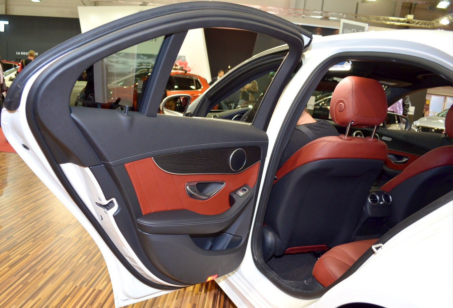 Rear door interior design with red leather and wood trim, red leather rear seats, ventilation vents