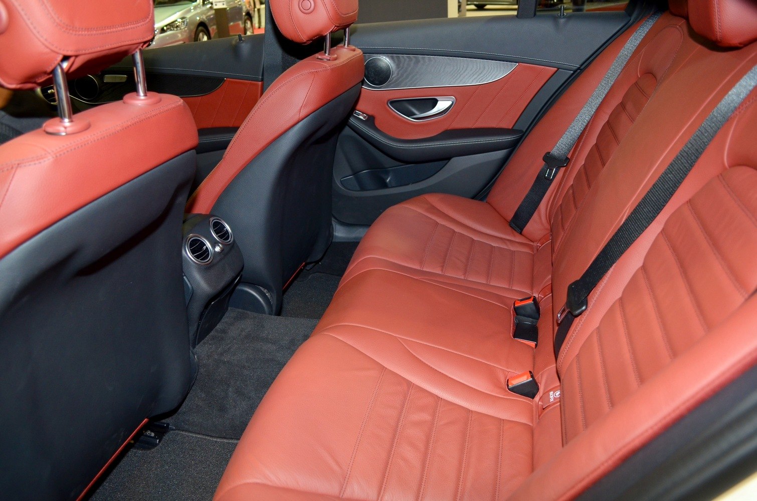 Red leather rear seats with rear air vents and door panel