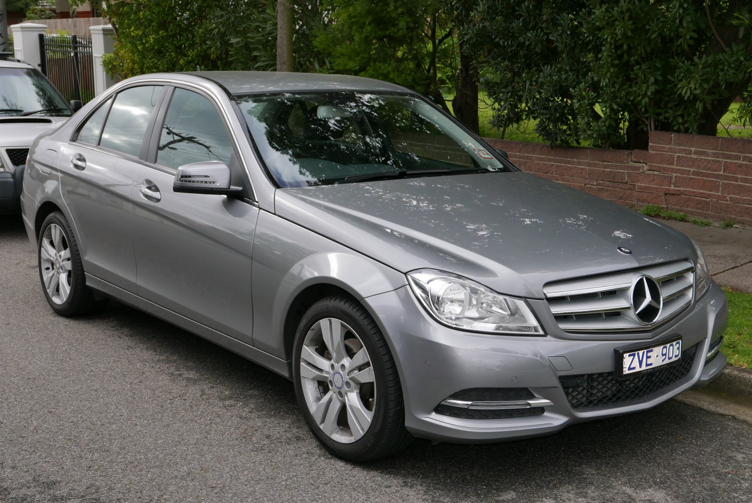 Silver sedan showing front and side with grille and alloy wheels