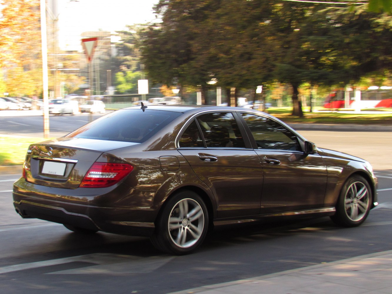 Rear side view of a modern sedan with distinctive taillights and alloy wheels