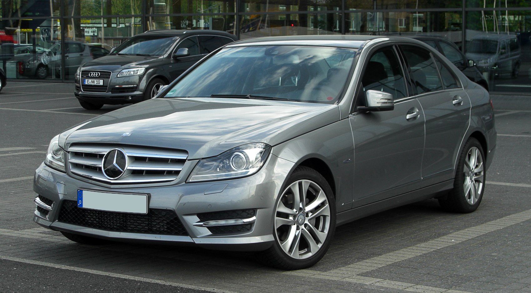 Front three-quarter view of silver sedan with alloy wheels