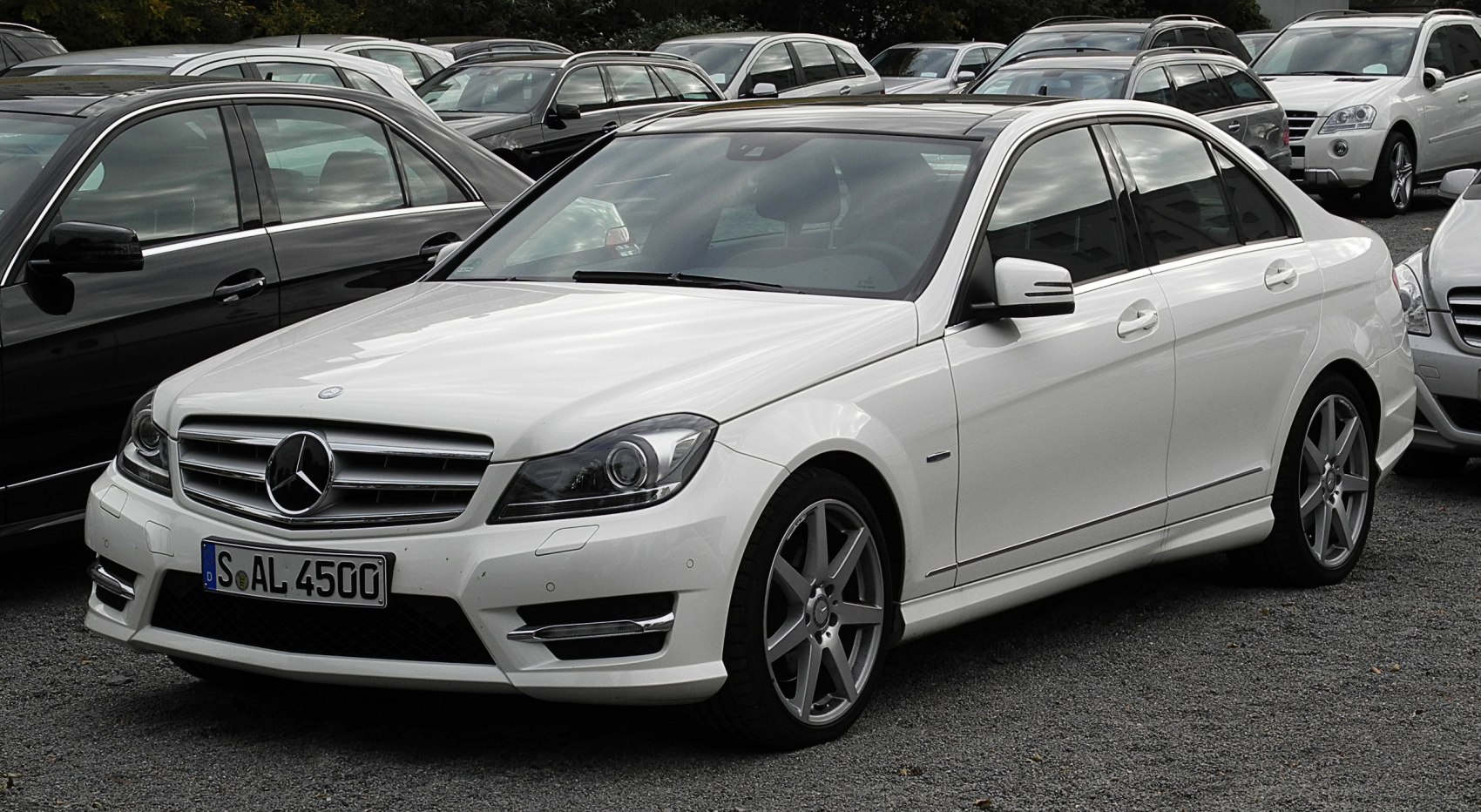 White sedan with distinctive grille and alloy wheels