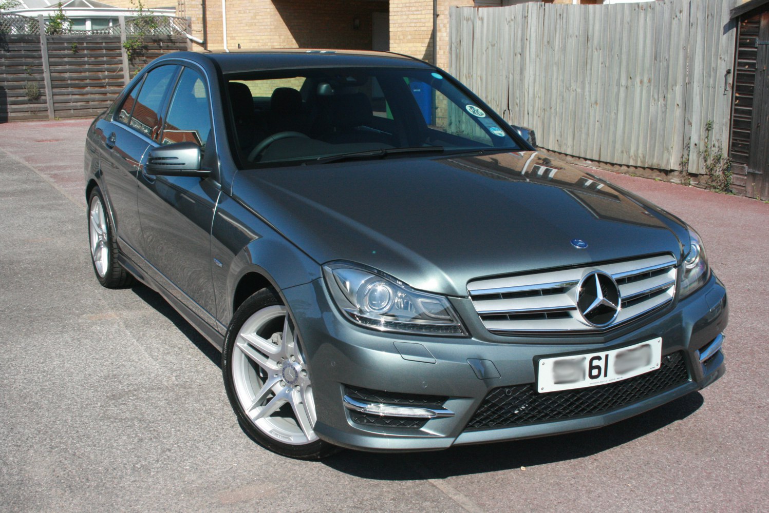 Front and side angle highlighting headlight and alloy wheel design