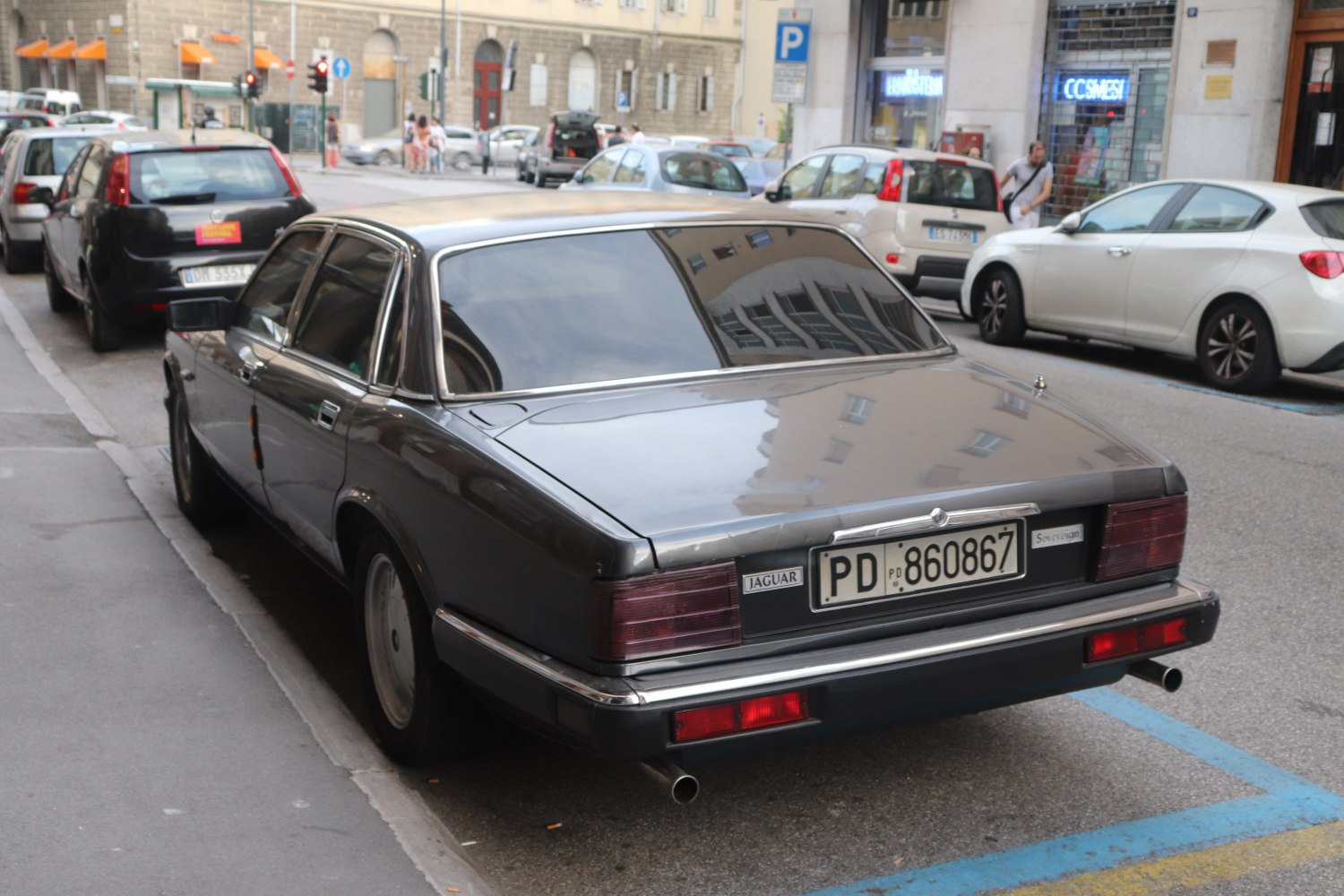 Rear view of vintage luxury sedan with classic taillights and sleek chrome trim
