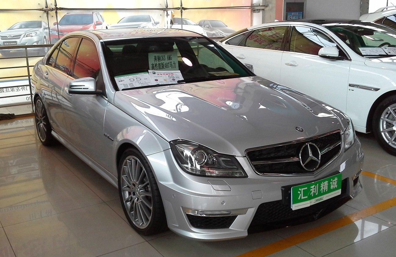 Silver sedan with AMG aerodynamic features and multi-spoke wheels