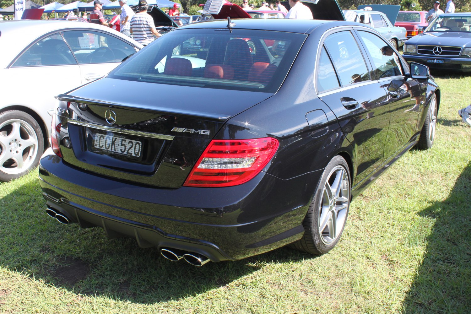 Rear view of sporty sedan with AMG quad exhaust and spoiler