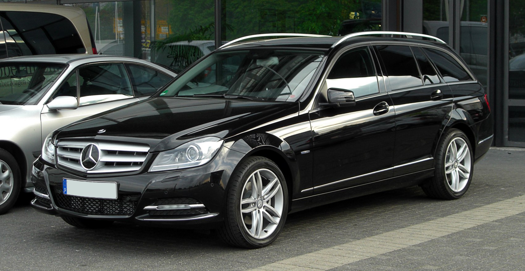 Black station wagon with alloy wheels and roof rails