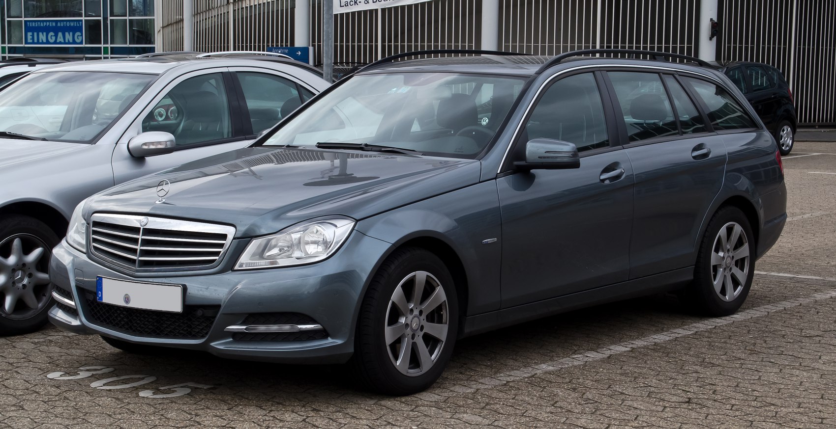 Front and side view of a modern station wagon with distinctive grille and alloy wheels