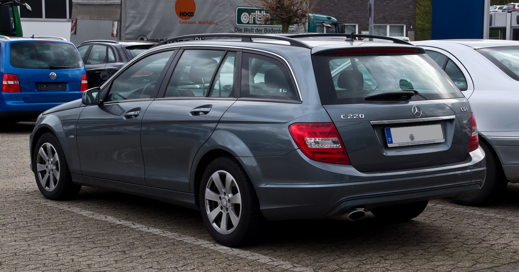 Station wagon rear side with tail lights and roof rails