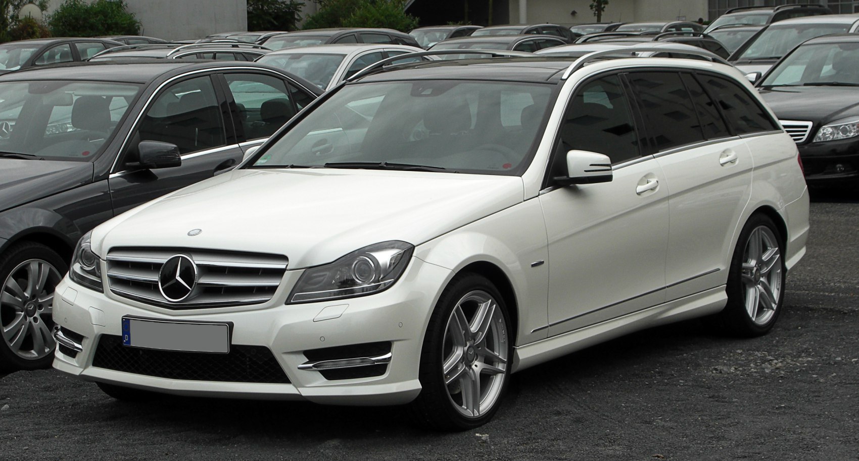 White station wagon with AMG wheels and sleek sporty front