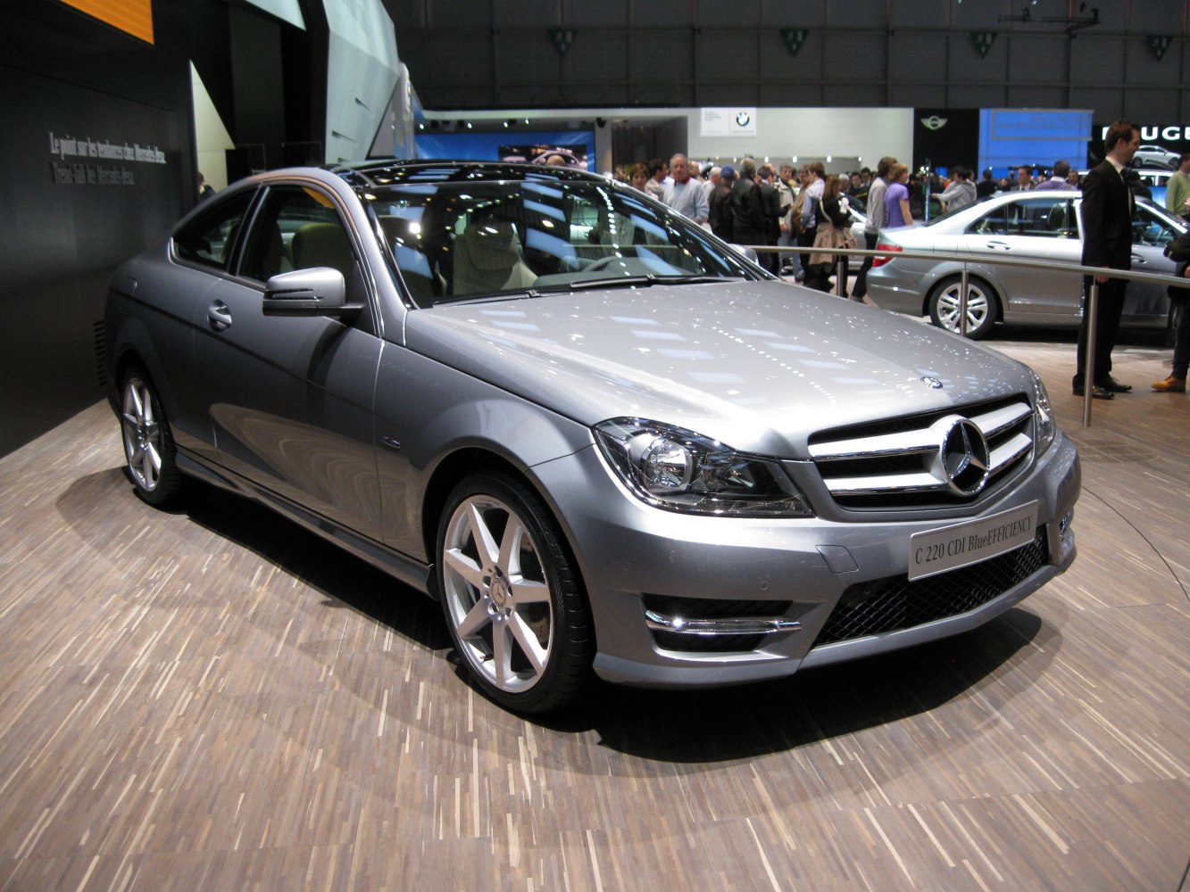 Silver coupe front angled view with alloy wheels