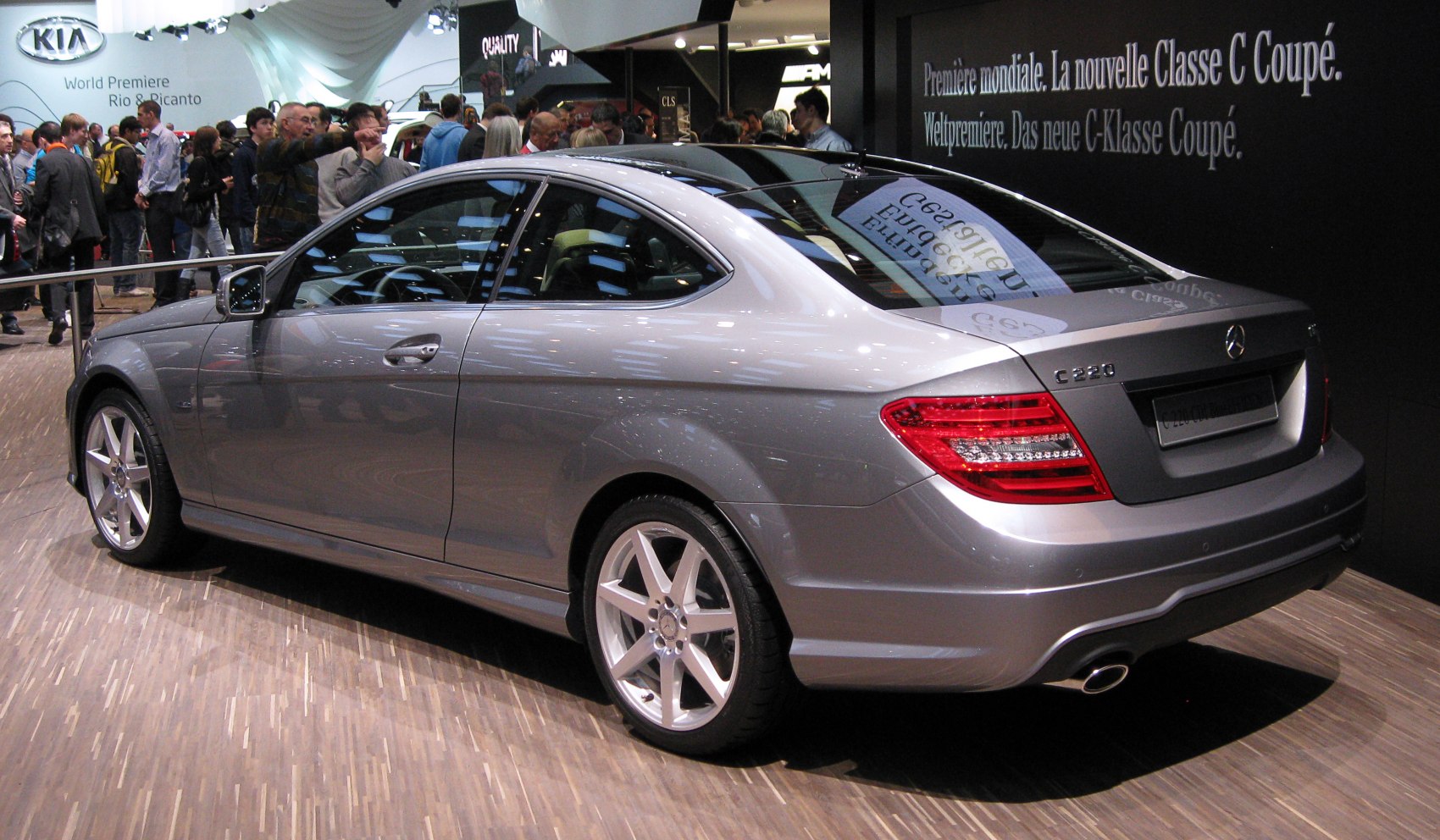 Rear design of silver coupe with distinctive tail lights and alloy wheels.