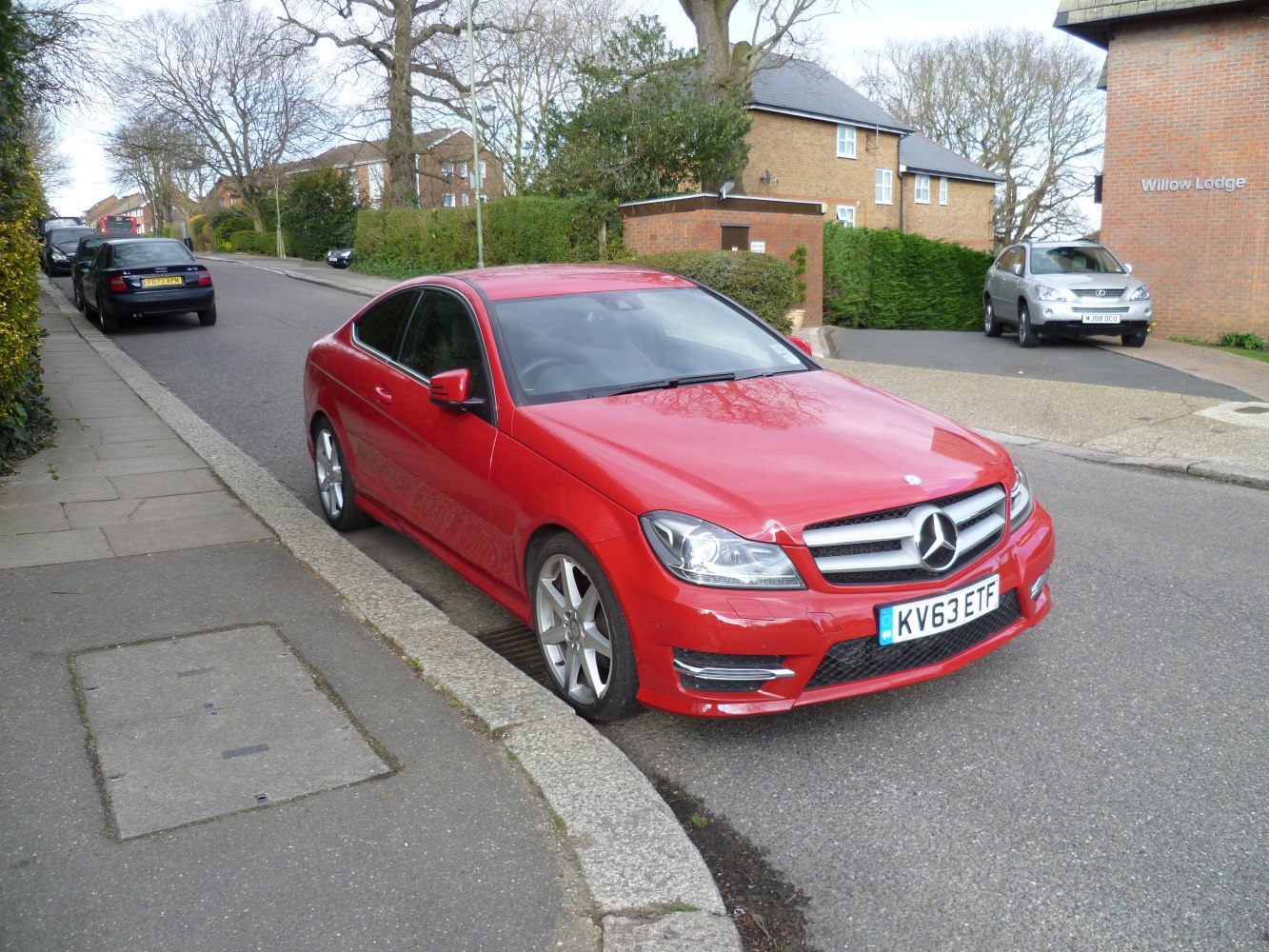 Front side view of sporty coupe with distinctive headlights