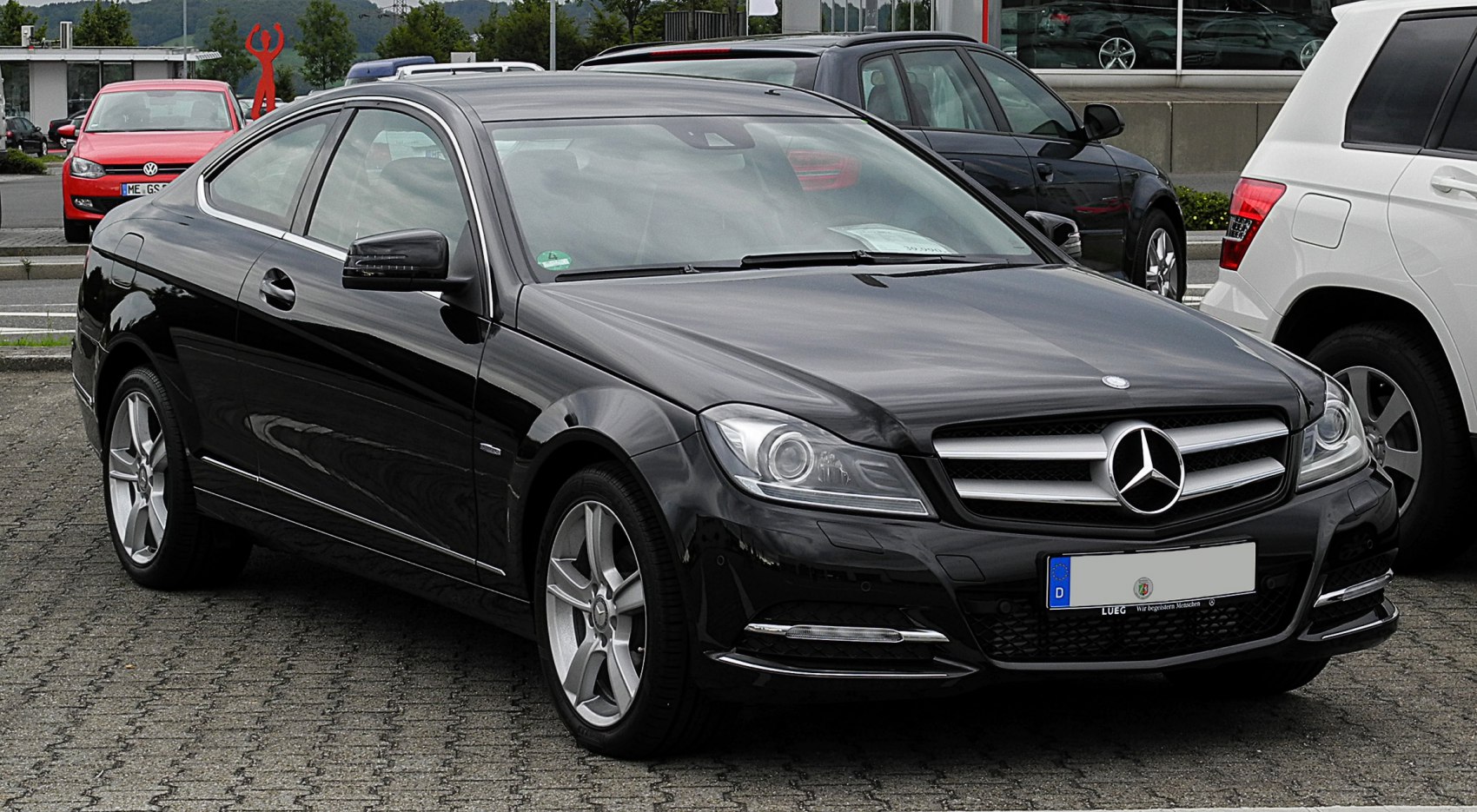 Black coupe with distinctive front grille and sleek side profile