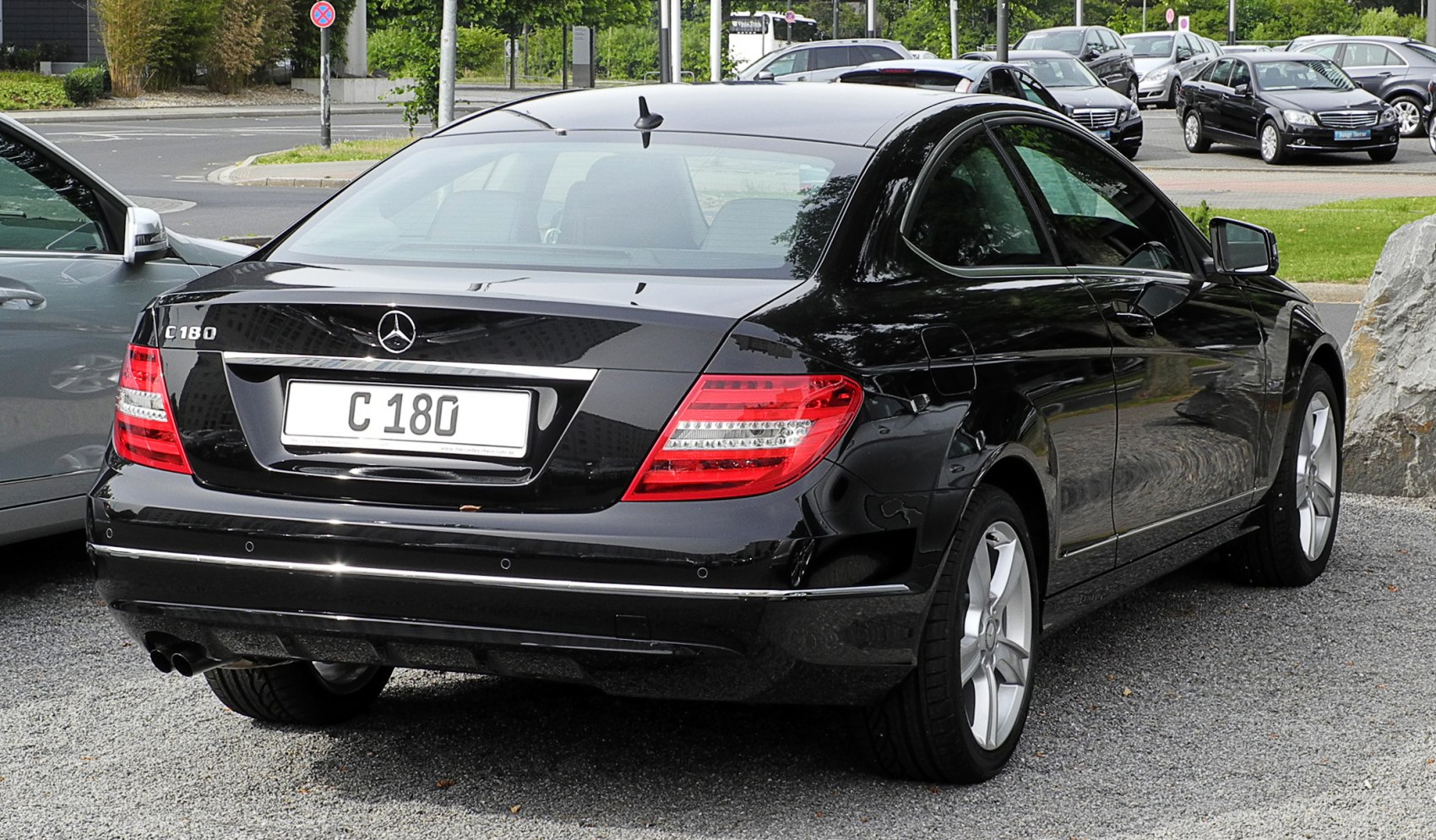 Black Mercedes C-class Coupe rear with taillights and dual exhaust