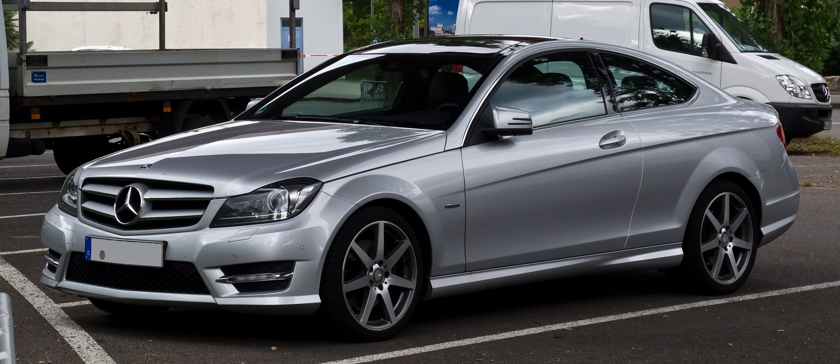 Silver sporty two-door luxury coupe with AMG-style wheels