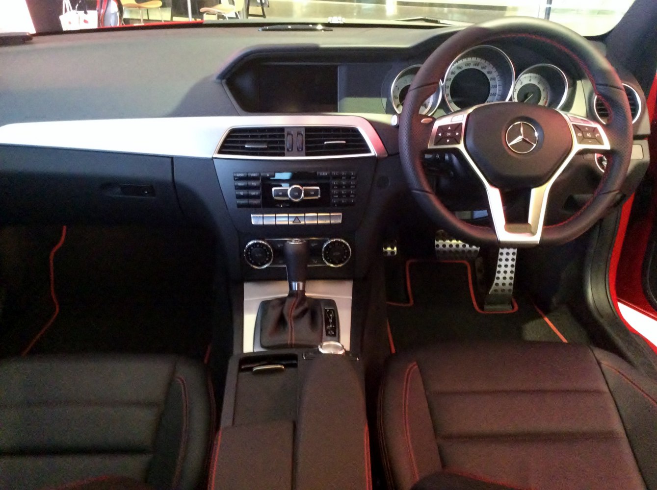 Interior dashboard with steering wheel and gear shift