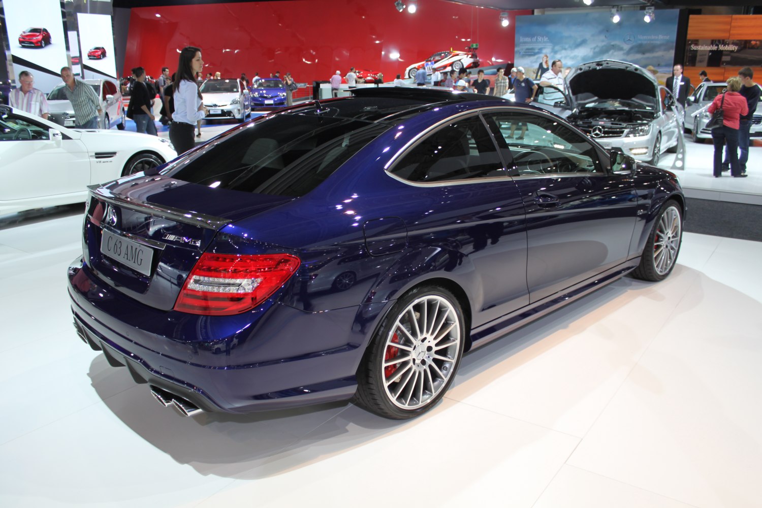 Rear side view of a luxury coupe with AMG styling and sport exhausts