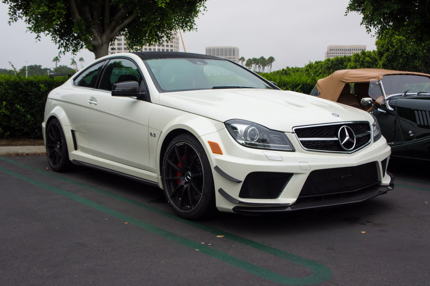 Front profile and black wheels of a sporty coupe