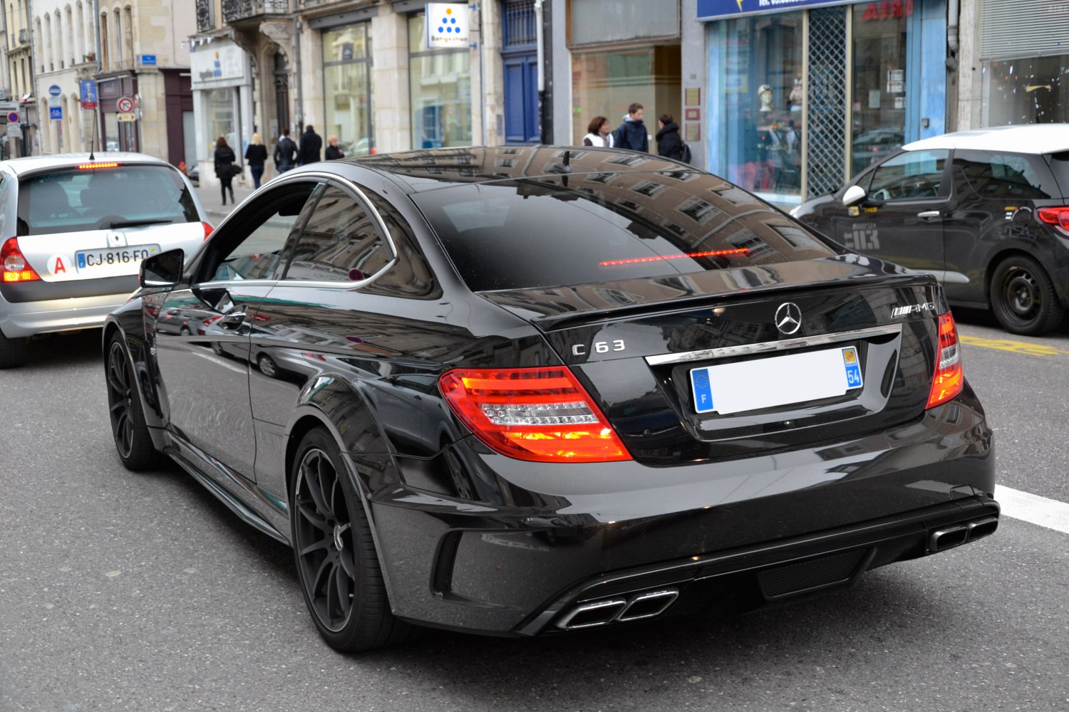 Black coupe with quad exhaust and sporty LED taillights