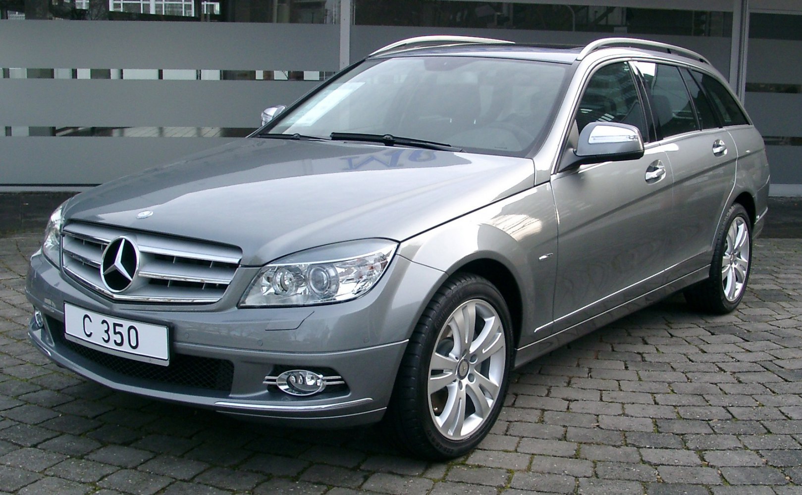 Front and side view of a silver wagon with alloy wheels and sleek design