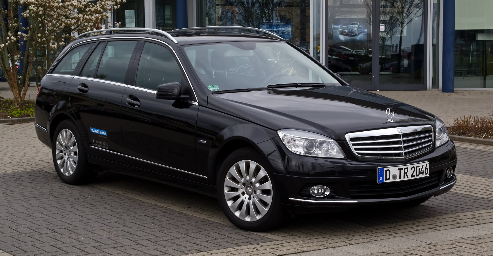 Black station wagon with chrome grille and roof rails