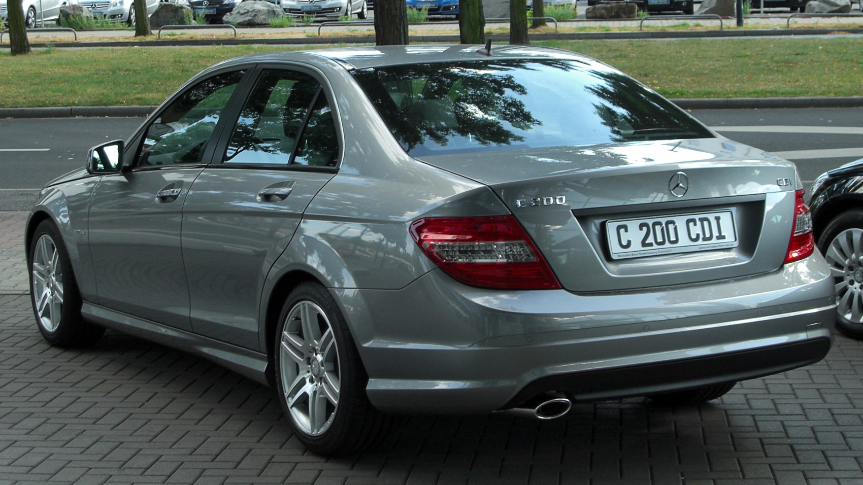 Compact sedan rear with LED tail lights and alloy wheels