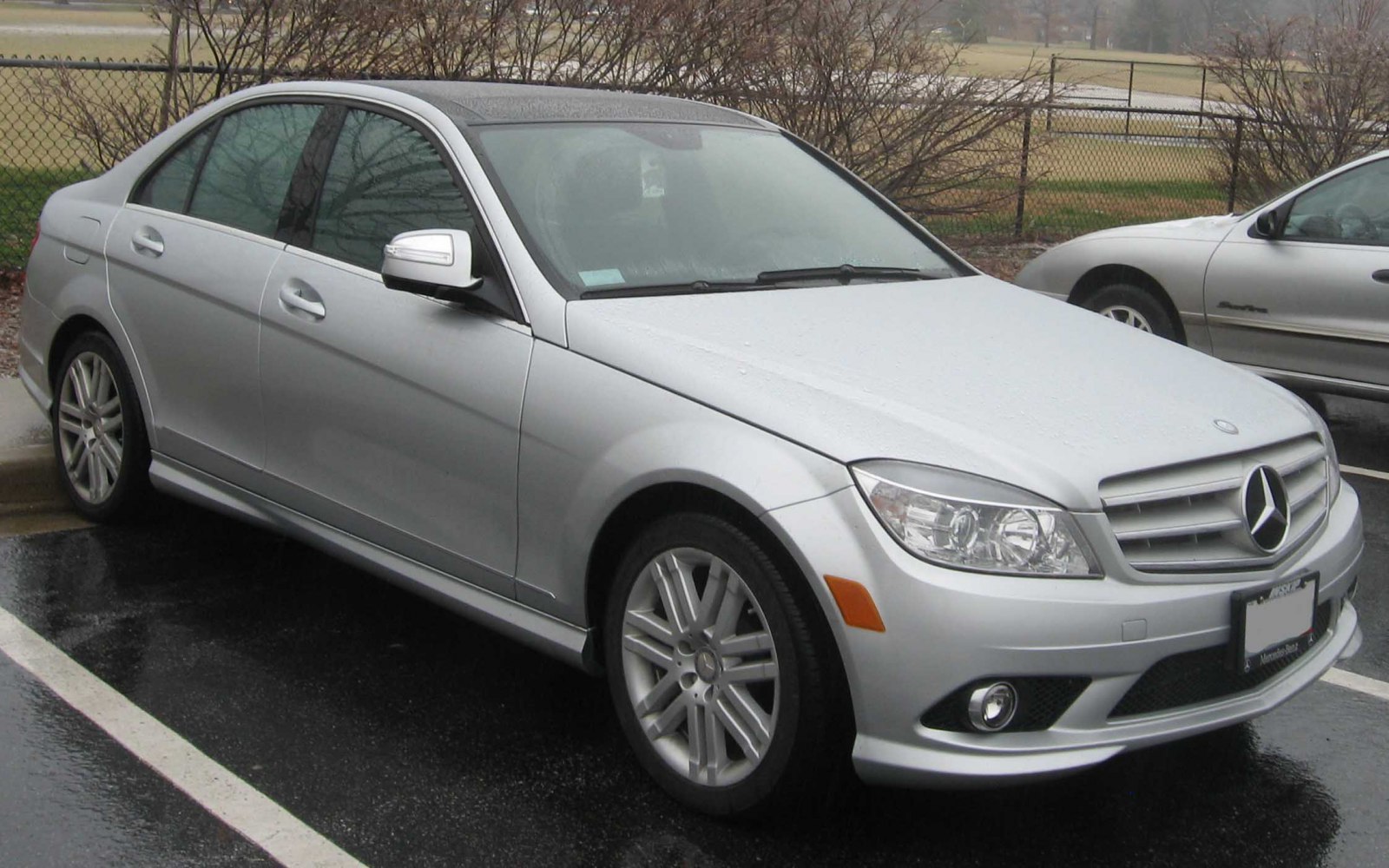 Silver sedan front side view with alloy wheels and Mercedes grille