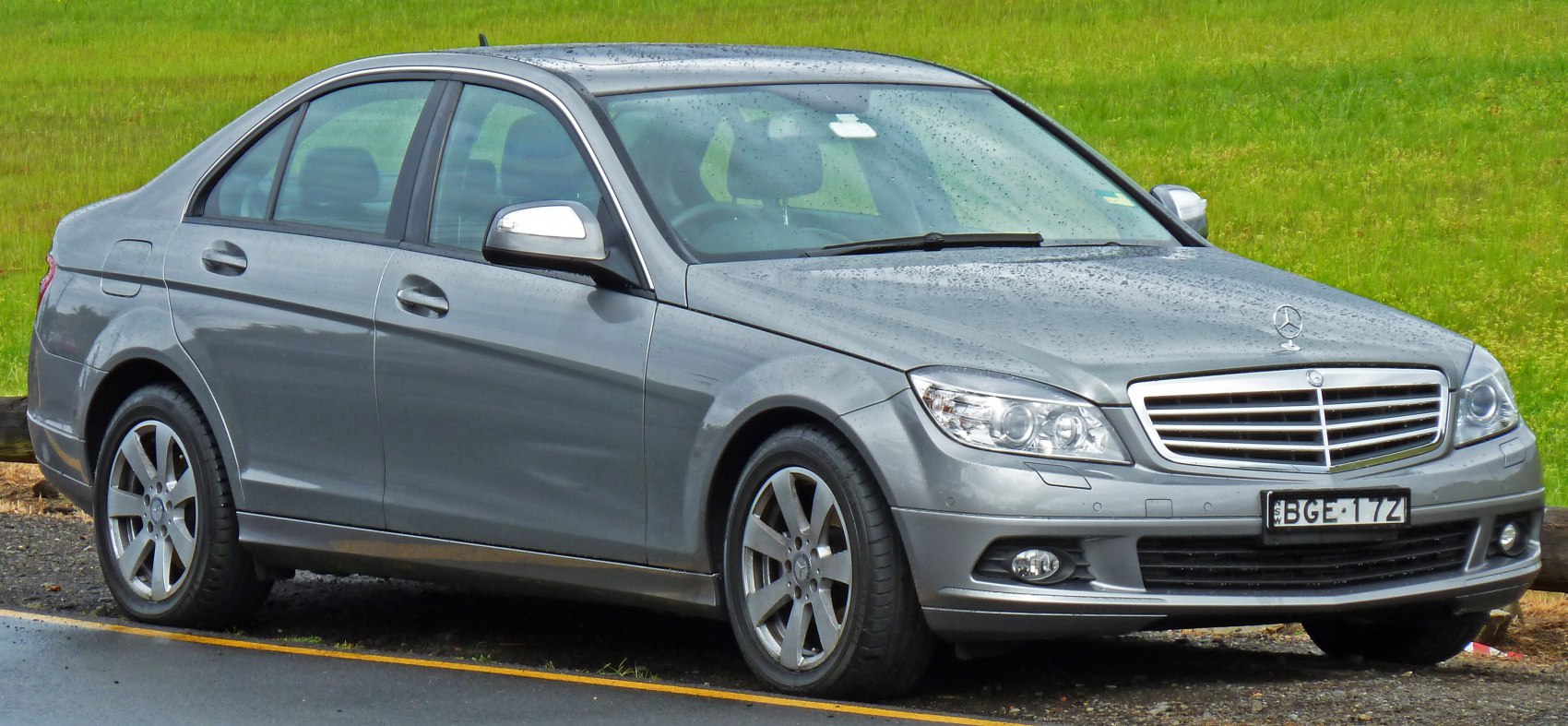 Luxury sedan with mesh grille, multibeam headlights, and alloy wheels