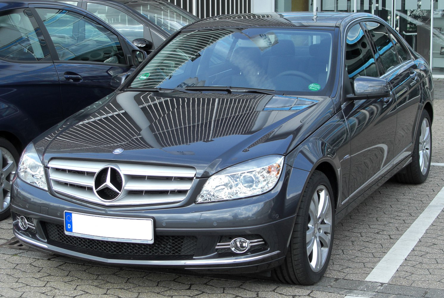 Front exterior shot showing grille, headlights, and alloy wheels.