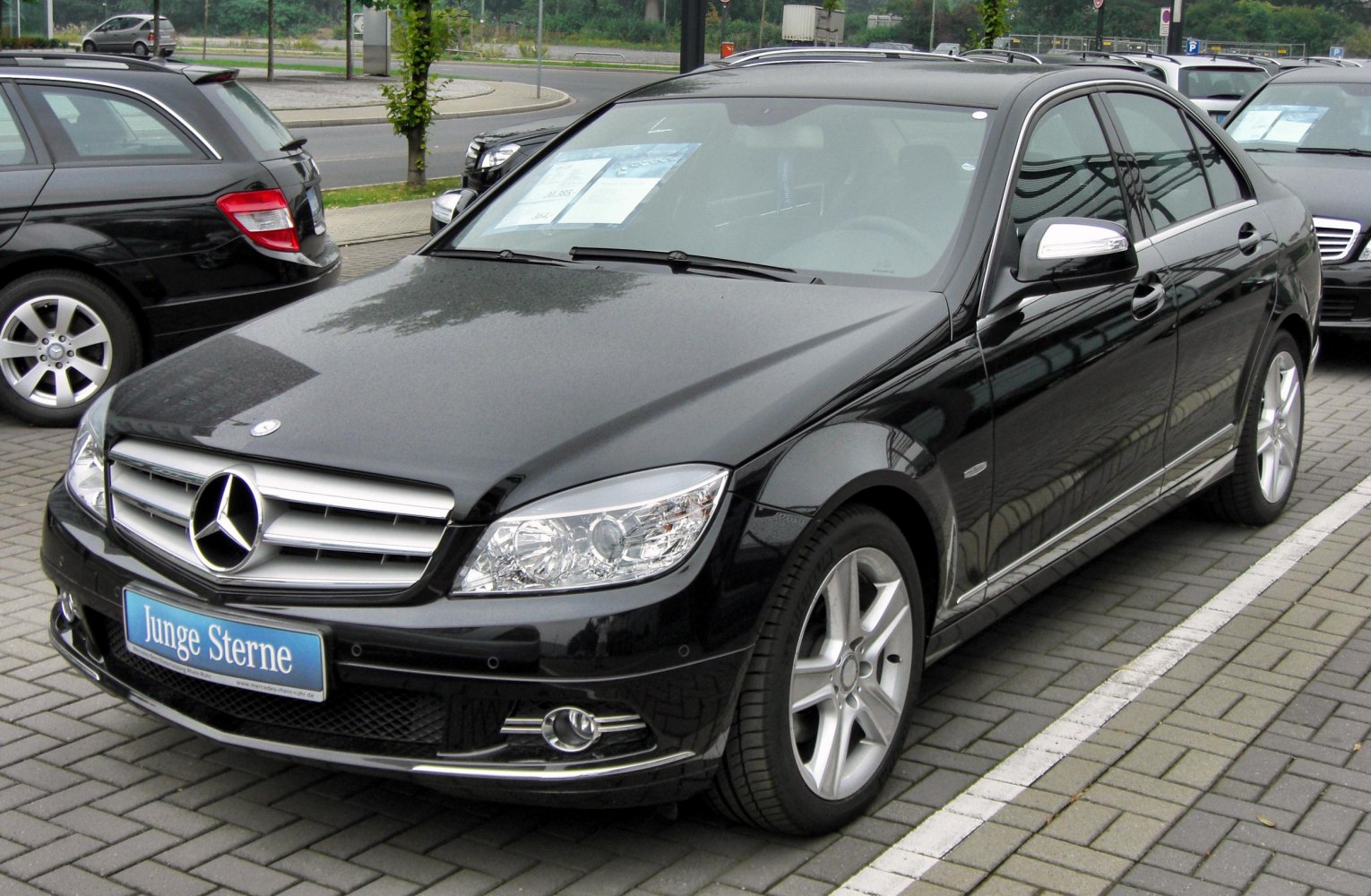 Black luxury sedan with alloy wheels and LED headlights
