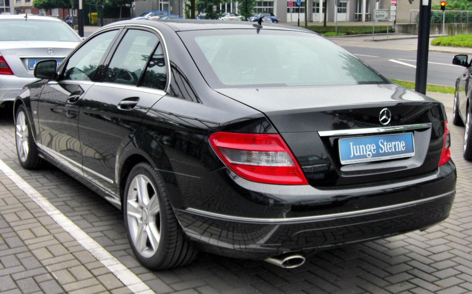 Rear side view with tail lights and alloy wheels
